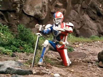 Metalder picking up sword