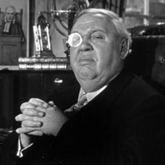 Sir Wilfrid wearing monocle