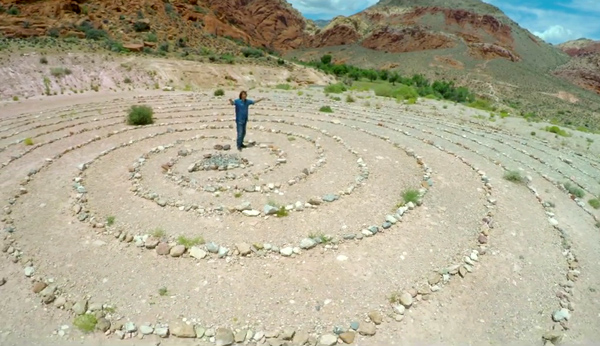 Thgil standing in rock circles