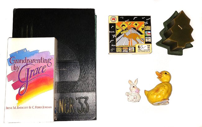 Yearbooks, VHS tape, coasters, candle, duck and rabbit figurines
