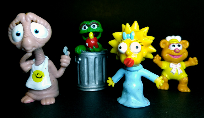 Random toys: ET, Oscar the Grouch, Maggie Simpson, Muppet Babies Fozie