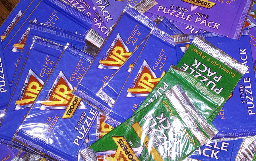 Pile of VR Troopers puzzle card packs